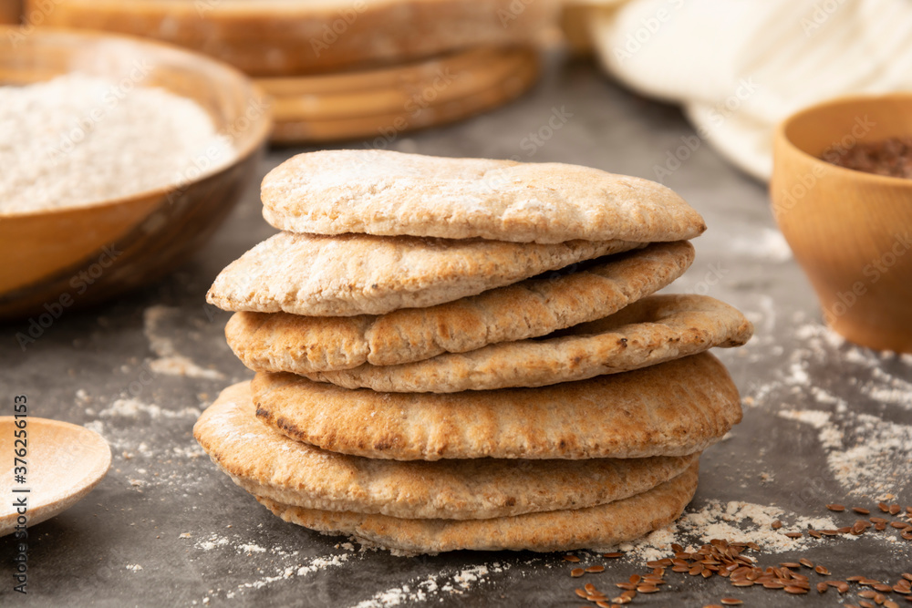 Pitta breads close up. Freshly baked wholegrain flat bread. Pitta breads close up. Freshly baked wholegrain flat bread.
