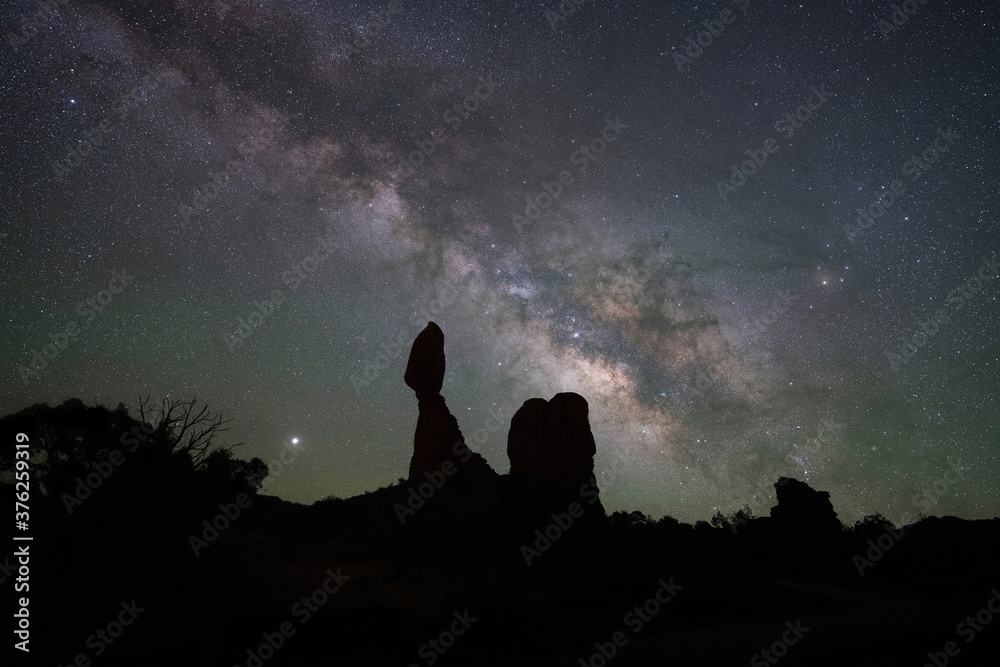Silhouette of Balanced Rock under the Stars and Night Sky