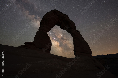 Delicate Arch silhouette with the Milky Way Galaxy intersecting