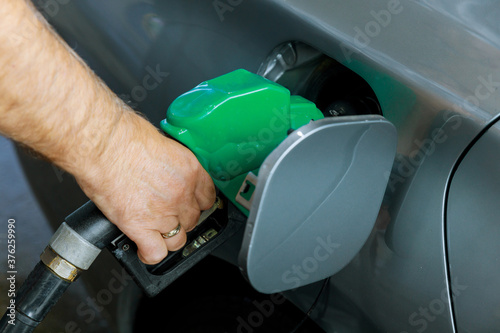 Pumping gasoline fuel in car transportation at gas station © ungvar