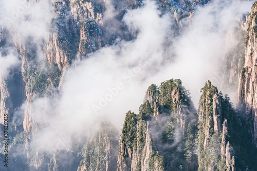 Clouds by the mountain peaks of Huangshan National park.