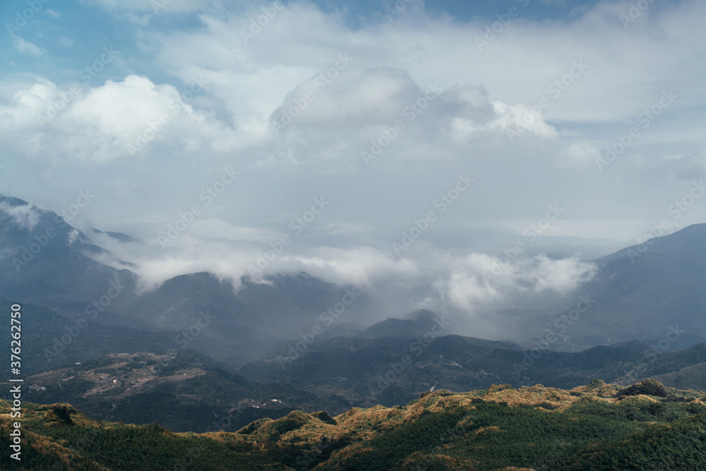 Natural Landscape. Clouds cover the peaks of the mountains