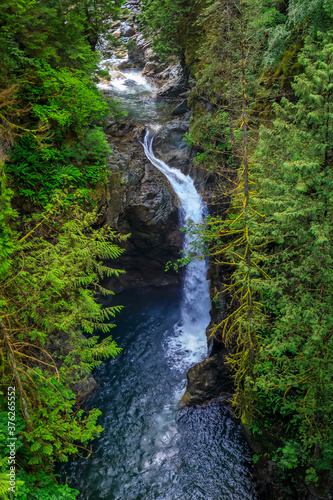 Long exposure of the iconic Norvan Falls at Lynn Canyon Park in North Vancouver, British Columbia photo