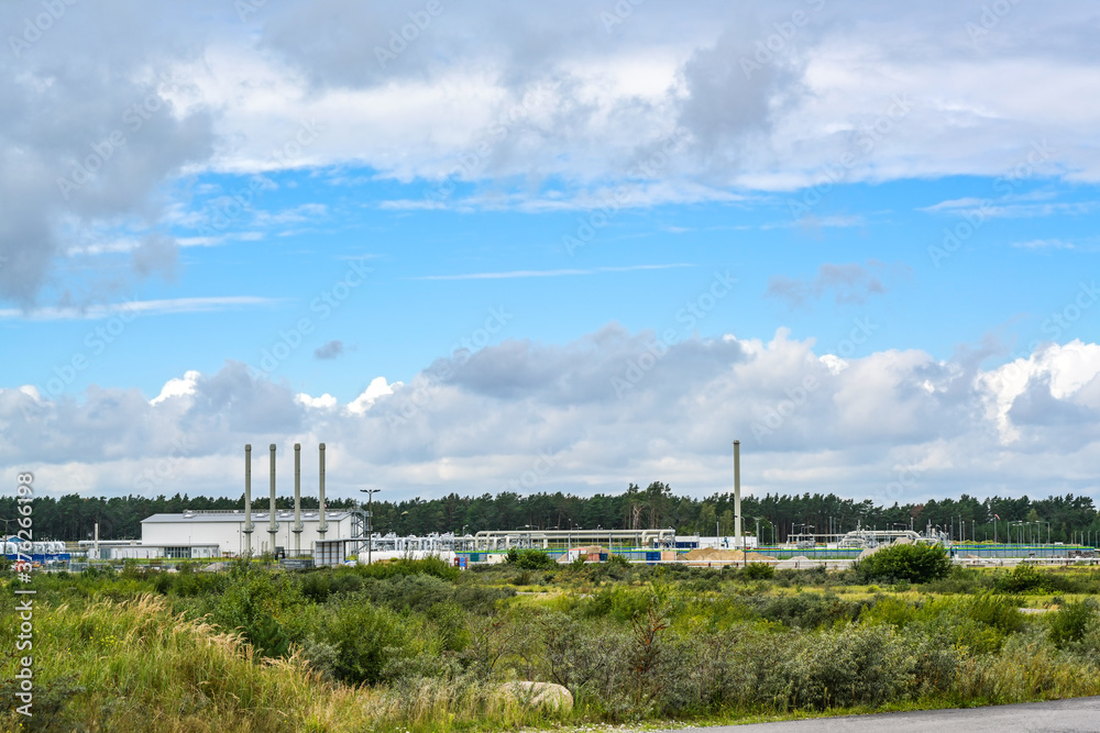 Nord stream in the industrial area of Lubmin near Greifswald, landfall of the natural gas pipeline through the Baltic Sea from Russia to Germany, blue sky with clouds and copy space Nord stream in the industrial area of Lubmin near Greifswald, landfall of the natural gas pipeline through the Baltic Sea from Russia to Germany, blue sky with clouds and copy space