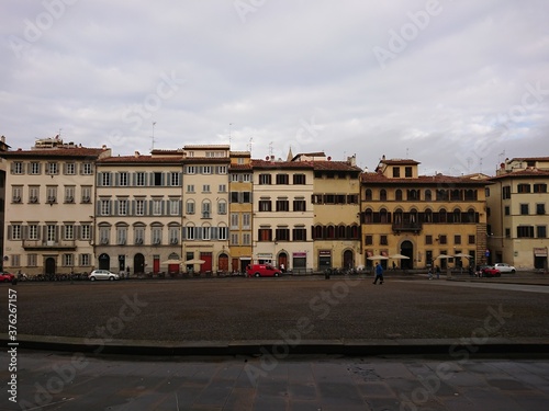 Row of Italian shop houses with variety of facades by the street