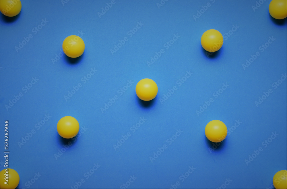 Group of yellow balls in line, on blue background Group of yellow balls in line, on blue background