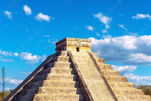 Konstfotografi Maya pyramid of Kukulkan (El Castillo) in Chichen Itza during the summer solstice, with the shadows of the feathered snake Quetzalcoatl by the stairs left, Yucatan, Mexico