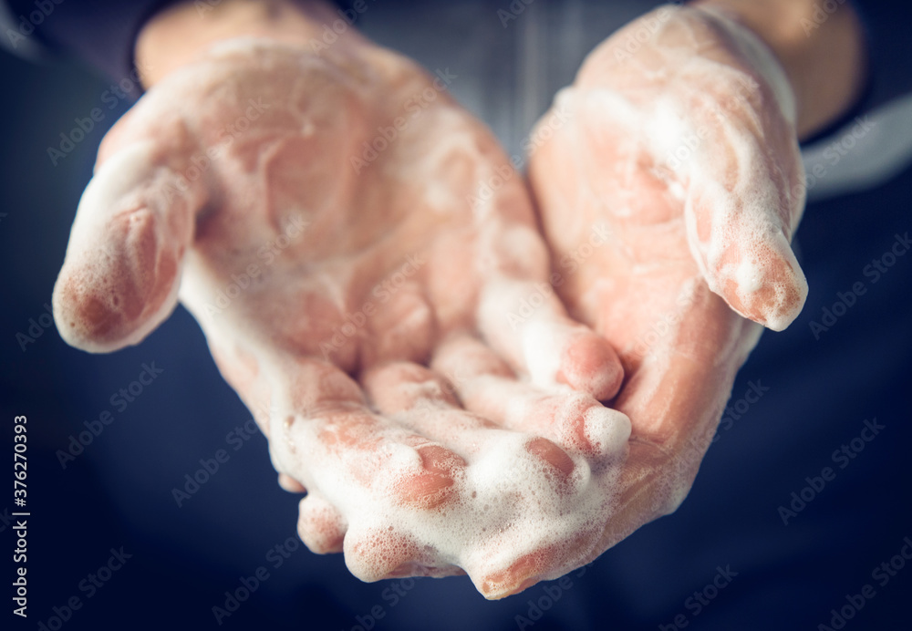Man's hands washed with soap and foam, close up. Man's hands washed with soap and foam, close up.
