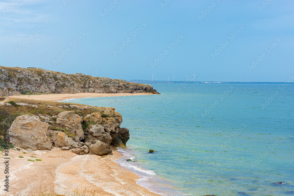 Coast line of the sea with stone rocks and beach 
