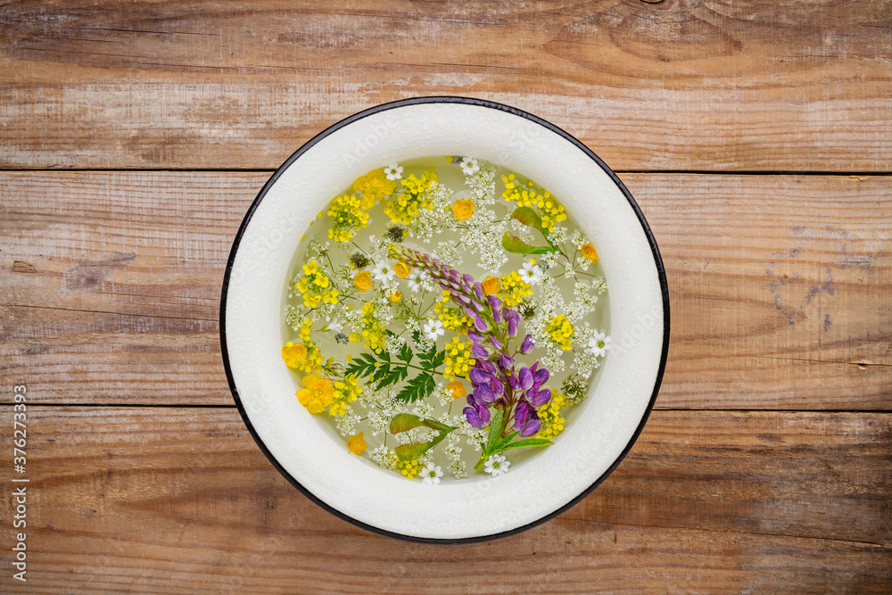 Floating wildflowers and herbs in a washbowl Floating wildflowers and herbs in a washbowl
