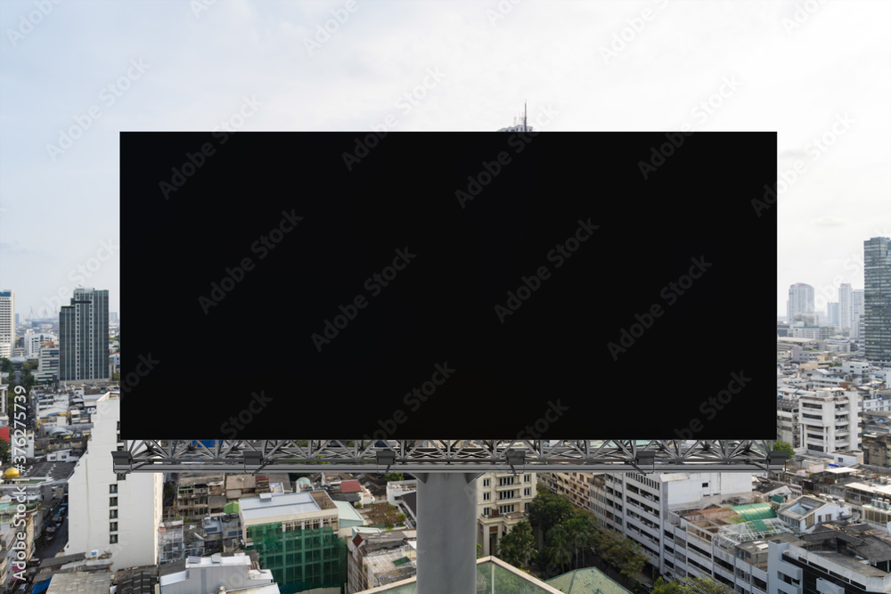 Blank black road billboard with Bangkok cityscape background at day time. Street advertising poster, mock up, 3D rendering. Front view. The concept of marketing communication to promote or sell idea. Blank black road billboard with Bangkok cityscape background at day time. Street advertising poster, mock up, 3D rendering. Front view. The concept of marketing communication to promote or sell idea.