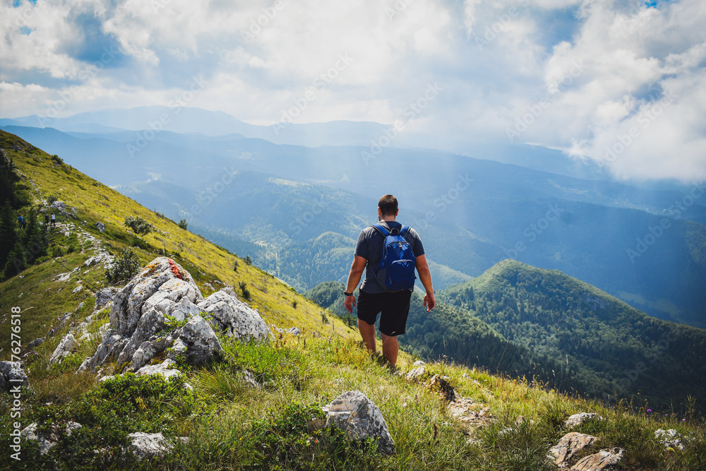 Young man hiking in mountains,  Trebevic Mountain Bosnia & Herzegovina 
