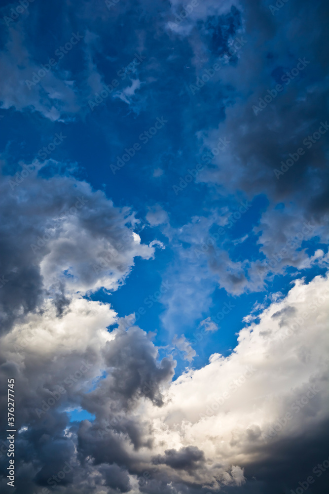 Fototapeta premium White and dark clouds on the blue sky