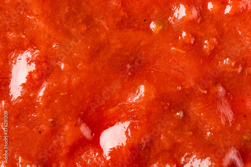 Ketchup or tomato sauce macro texture background. © Nikolay N. Antonov
