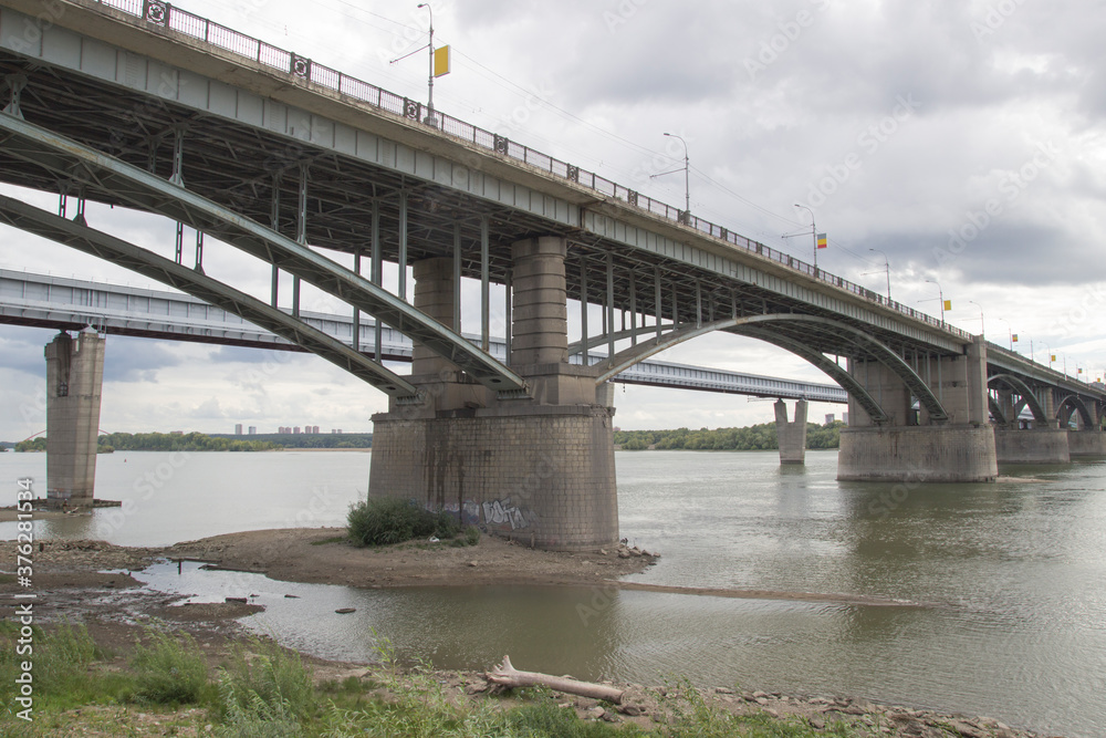 Bridges over the Ob river in Novosibirsk. The world's largest metro bridge and Communal bridge across Ob river in Novosibirsk, Russia Bridges over the Ob river in Novosibirsk. The world's largest metro bridge and Communal bridge across Ob river in Novosibirsk, Russia