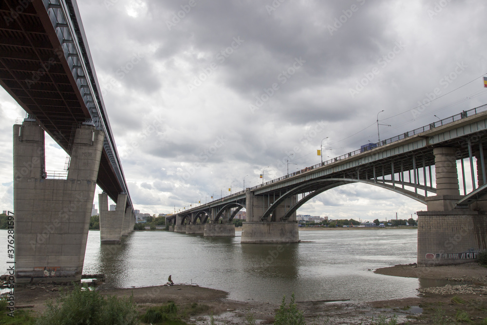 Bridges over the Ob river in Novosibirsk. The world's largest metro bridge and Communal bridge across Ob river in Novosibirsk, Russia Bridges over the Ob river in Novosibirsk. The world's largest metro bridge and Communal bridge across Ob river in Novosibirsk, Russia