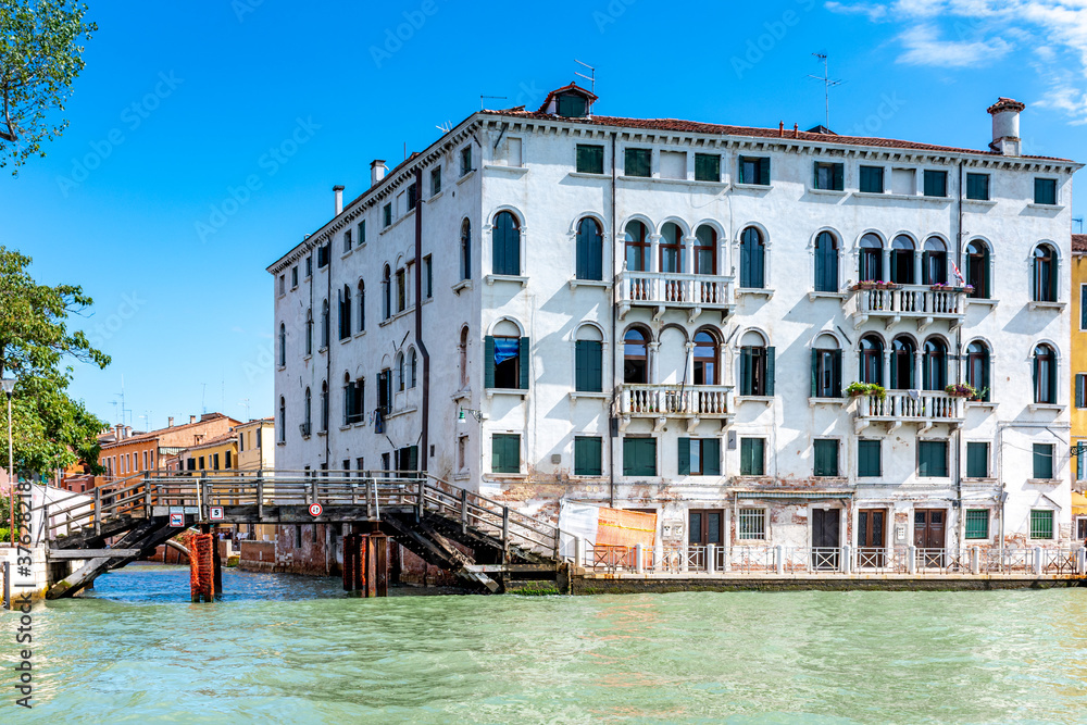 Fototapeta premium Tenement house and water canal in Venice, Italy
