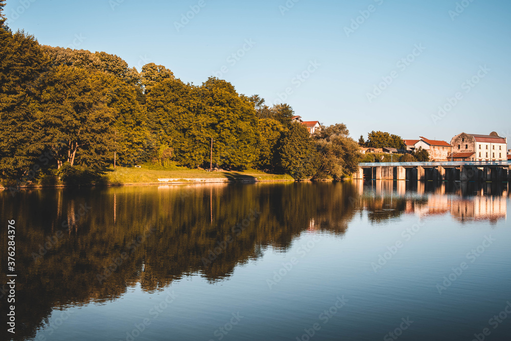 Landscape photo of Vlasina river in Serbia with reflections in the water