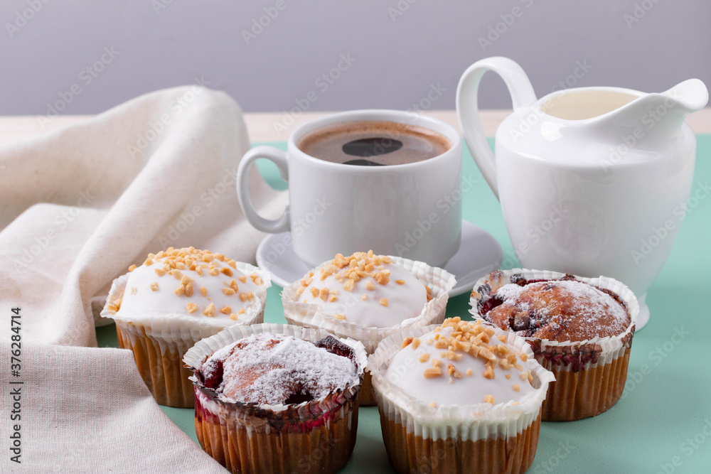 yummy sweet tasty muffin cakes on simple mono color background yummy sweet tasty muffin cakes on simple mono color background