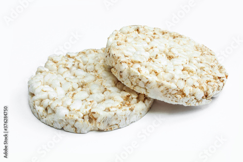 Two pieces of rice cake isolated on white. Dry dietary food