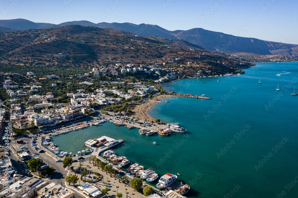 ELOUNDA, CRETE, GREECE - 22 AUGUST 2020: Aerial view of the popular Greek town and port of Elounda on the island of Crete