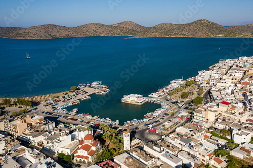 ELOUNDA, CRETE, GREECE - 22 AUGUST 2020: Aerial view of the popular Greek town and port of Elounda on the island of Crete