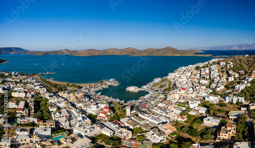ELOUNDA, CRETE, GREECE - 22 AUGUST 2020: Panoramic aerial view of the popular Greek town and port of Elounda on the island of Crete
