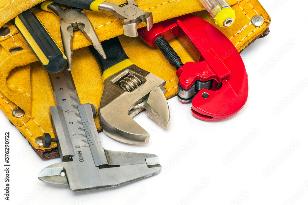 Builder tool set in suede bag on white background