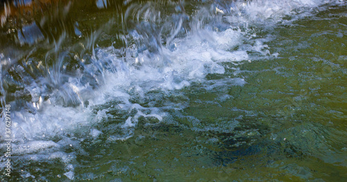 Canvastavla Flowing water texture. Water gurgles in the fountain.