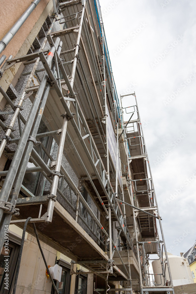 renovation work with scaffolding on a town house
