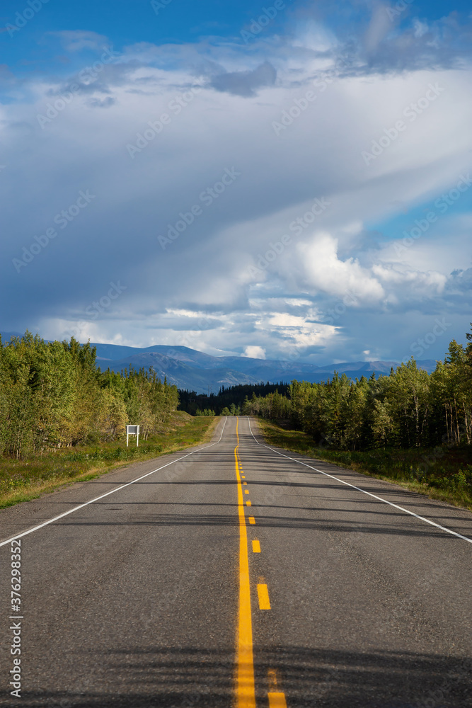 Scenic Road View of Klondike Hwy during a sunny and cloudy day. Taken near Whitehorse, Yukon, Canada.