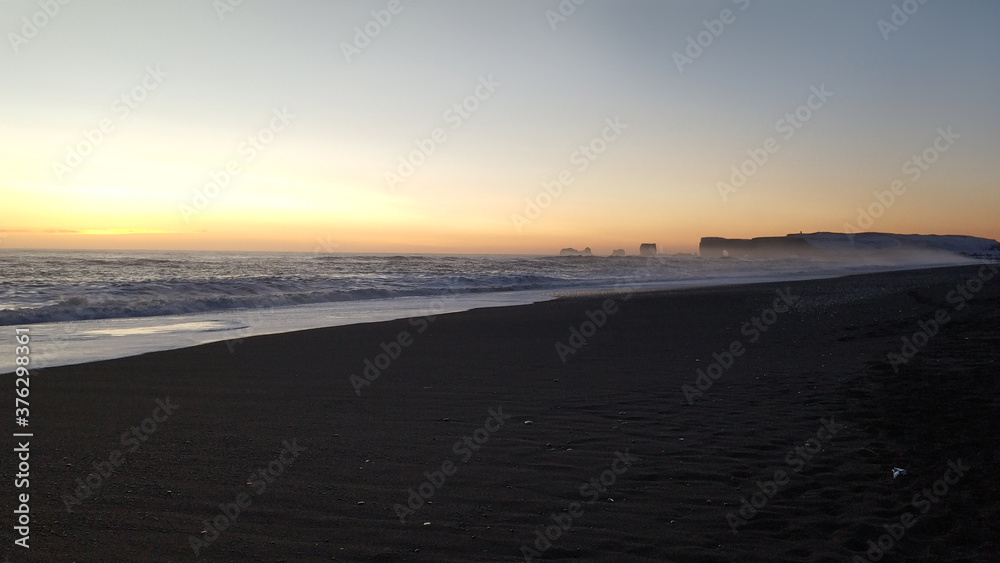 Winter landscape, oceanic beach with black volcanic sand in iceland