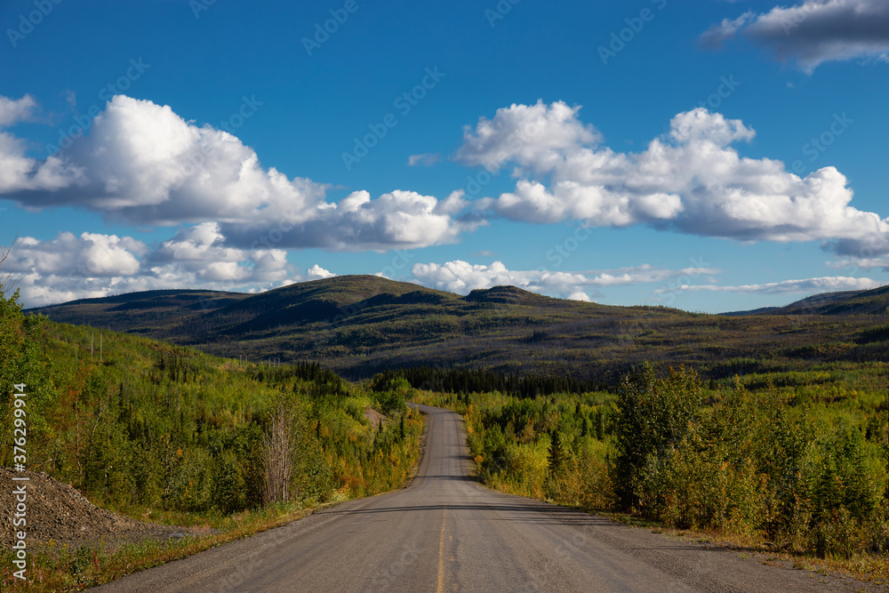 Scenic Road View of Klondike Hwy during a sunny and cloudy day. Taken near Whitehorse, Yukon, Canada.