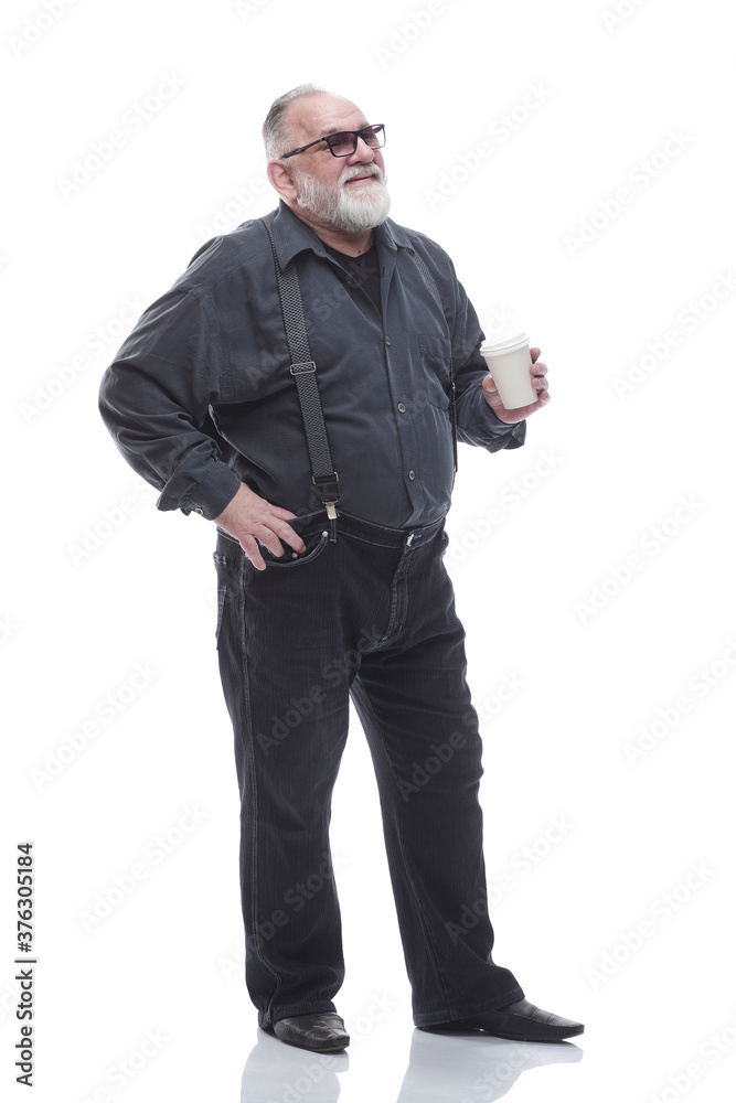full- length . a successful older man drinks takeaway coffee full- length . a successful older man drinks takeaway coffee