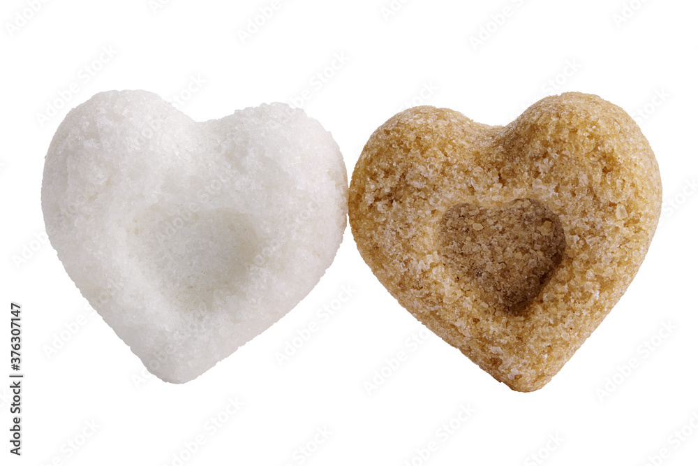 Obraz premium A pair of heart-shaped sugar cubes isolated on white. Interracial relationship metaphor