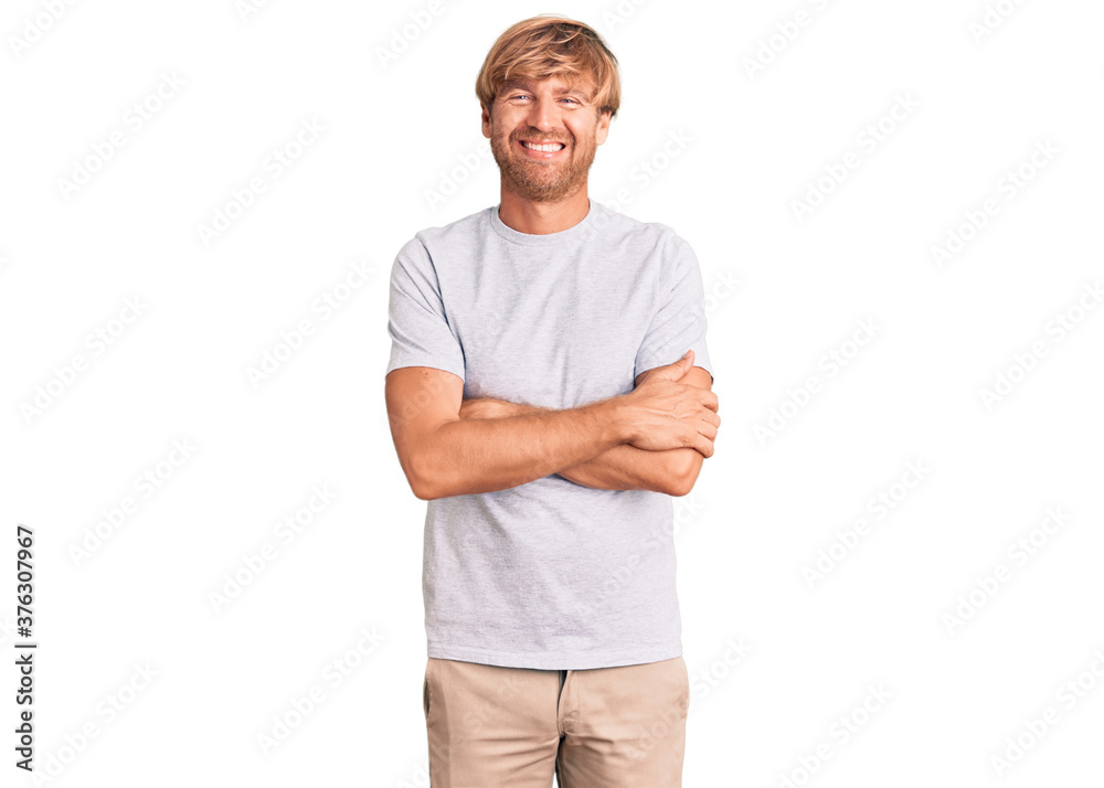 Handsome caucasian man with beard wearing casual tshirt happy face smiling with crossed arms looking at the camera. positive person. Handsome caucasian man with beard wearing casual tshirt happy face smiling with crossed arms looking at the camera. positive person.