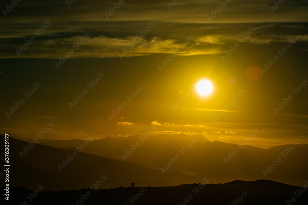 beginning of the sunset behind the mountains