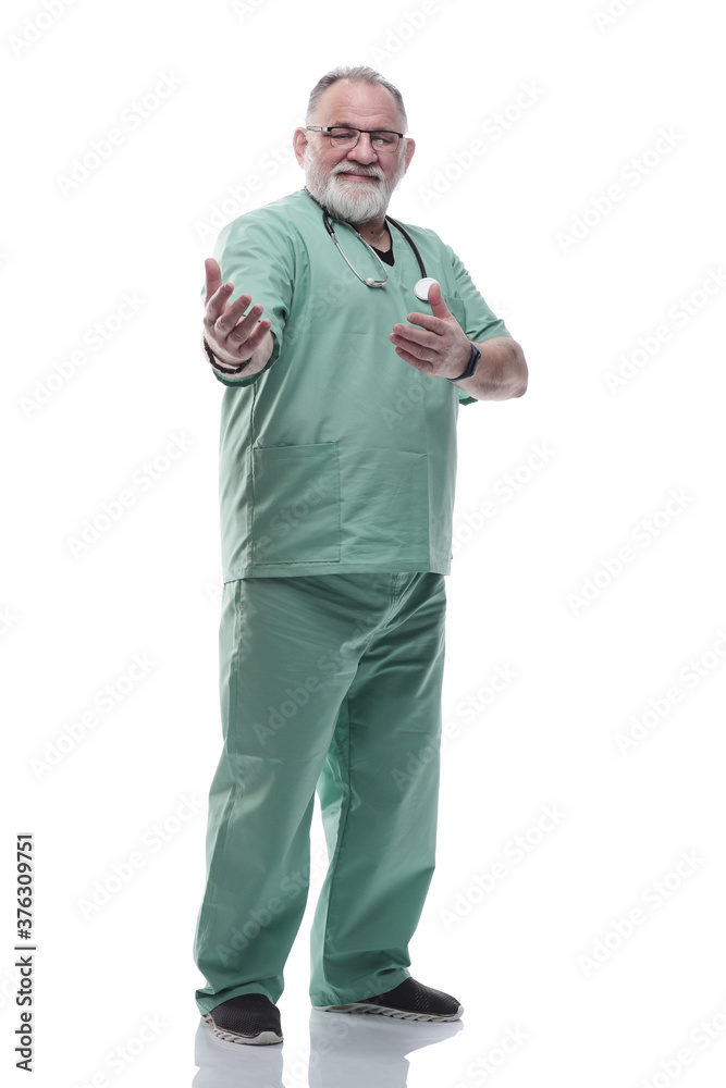 in full growth. smiling adult doctor looking at the camera in full growth. smiling adult doctor looking at the camera