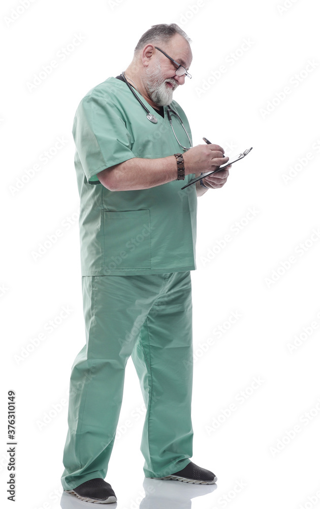 Mature doctor writing a prescription for a patient Mature doctor writing a prescription for a patient