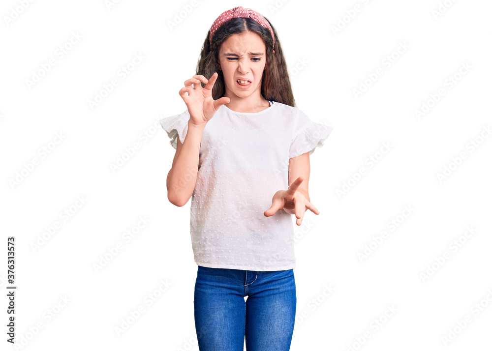 Cute hispanic child girl wearing casual white tshirt disgusted expression, displeased and fearful doing disgust face because aversion reaction. Cute hispanic child girl wearing casual white tshirt disgusted expression, displeased and fearful doing disgust face because aversion reaction.