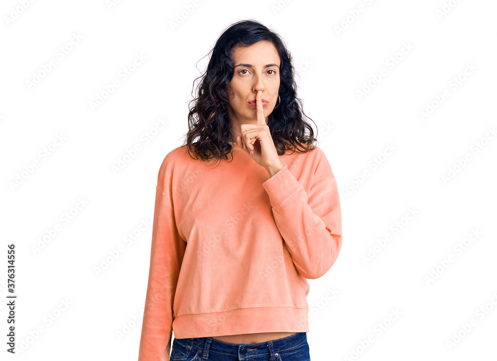 Young beautiful hispanic woman wearing casual clothes asking to be quiet with finger on lips. silence and secret concept. Young beautiful hispanic woman wearing casual clothes asking to be quiet with finger on lips. silence and secret concept.