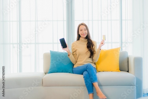 Portrait beautiful young asian woman with credit card and smart phone