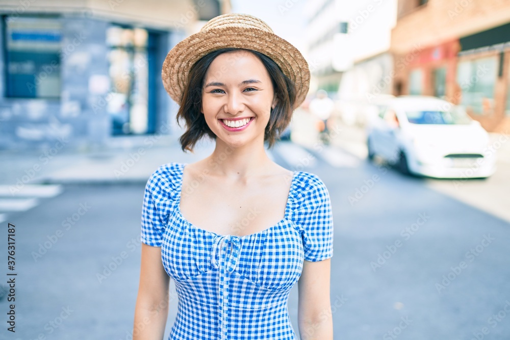 Young beautiful girl smiling happy walking at street of city