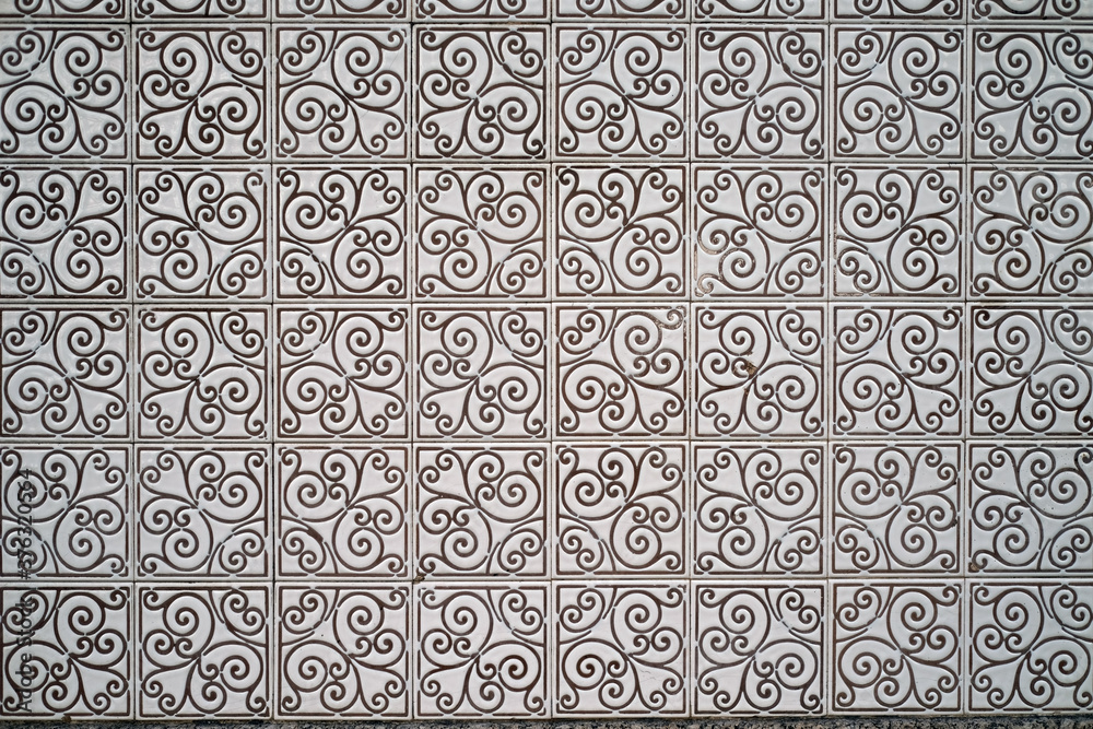 Traditional old tiles wall on the street painted tin-glazed, azulejos ceramic tilework. Porto, Portugal.