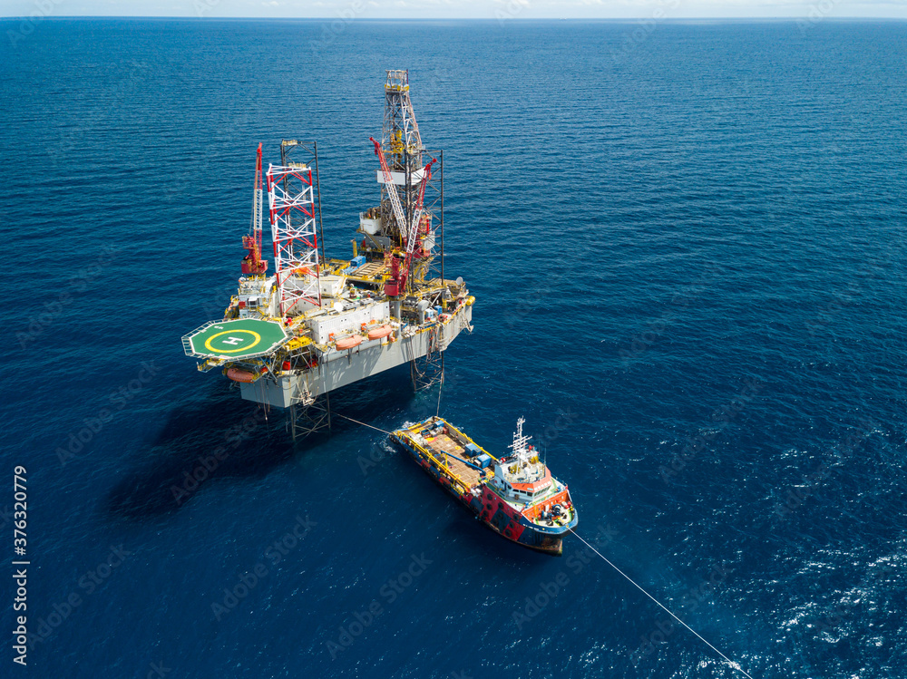 Aerial view from a drone of an offshore jack up rig at the offshore location during day time