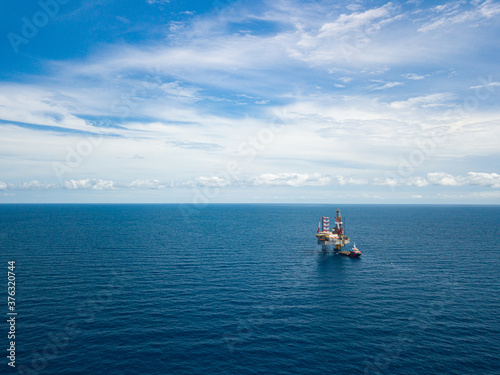 Aerial view from a drone of an offshore jack up rig at the offshore location during day time