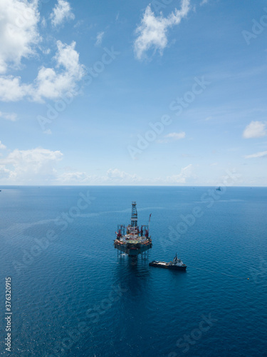 Aerial view from a drone of an offshore jack up rig at the offshore location during day time © bomboman