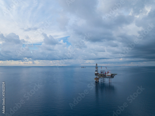 Aerial view from a drone of an offshore jack up rig at the offshore location during raining time