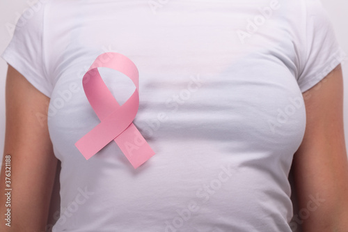 Wallpaper Mural pink ribbon on the female breast, breast cancer fight symbol Torontodigital.ca