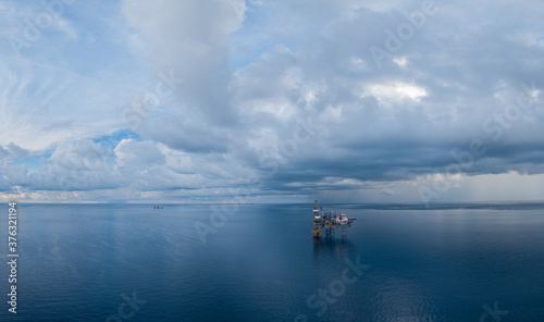 Panoramic aerial view from a drone of an offshore jack up rig at the offshore location during day time